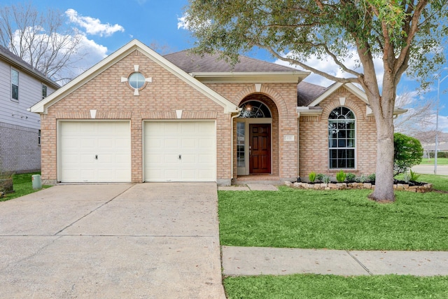 431 Cardinal Oaks, League City, TX 77565 - traditional-style home with brick siding, a front yard, a garage, roof with shingles, and concrete driveway