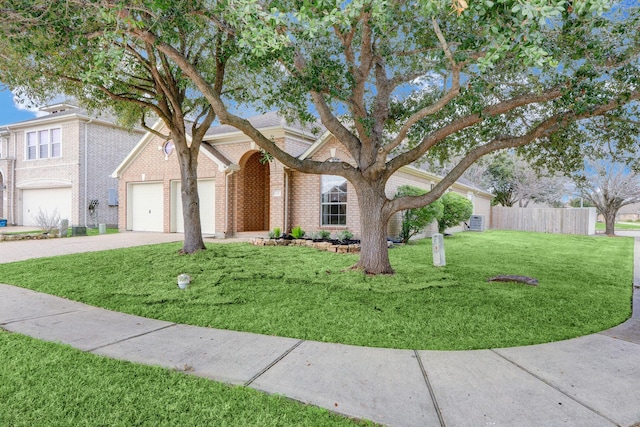 431 Cardinal Oaks, League City, TX 77565 - traditional-style house with brick siding, concrete driveway, and a garage