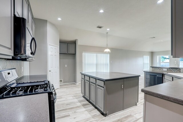 431 Cardinal Oaks, League City, TX 77565 - kitchen featuring gas range oven, backsplash, gray cabinetry, light wood-style flooring, and recessed lighting