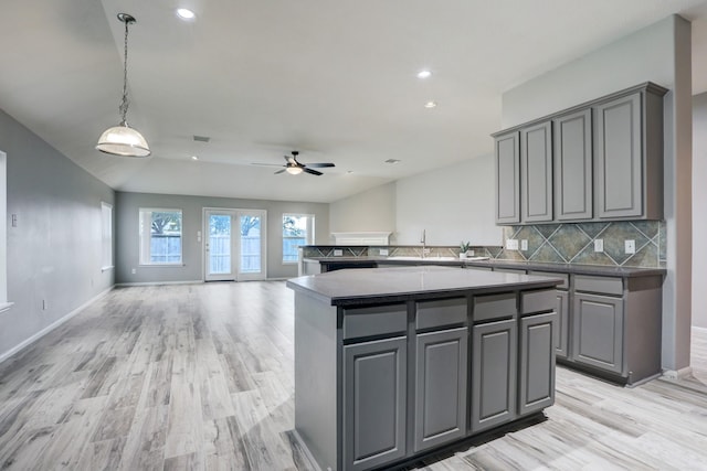 431 Cardinal Oaks, League City, TX 77565 - kitchen with gray cabinetry, recessed lighting, light wood finished floors, a ceiling fan, and tasteful backsplash