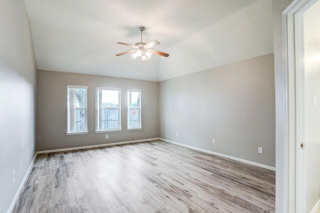 431 Cardinal Oaks, League City, TX 77565 - empty room featuring a ceiling fan, wood finished floors, lofted ceiling, and baseboards
