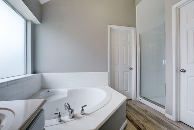 431 Cardinal Oaks, League City, TX 77565 - bathroom featuring a stall shower, a whirlpool tub, wood finished floors, and vanity