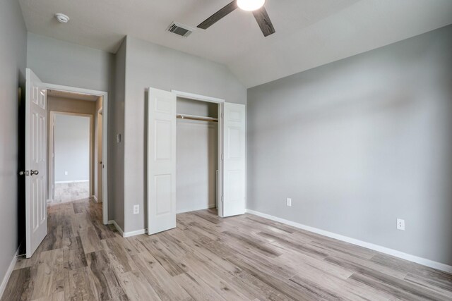 431 Cardinal Oaks, League City, TX 77565 - unfurnished bedroom with light wood-style floors, lofted ceiling, a closet, baseboards, and a ceiling fan