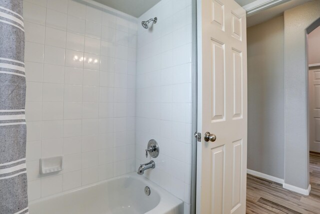 431 Cardinal Oaks, League City, TX 77565 - full bathroom featuring  shower combination, wood finished floors, and baseboards