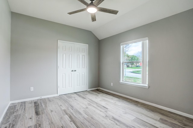 431 Cardinal Oaks, League City, TX 77565 - unfurnished bedroom featuring wood finished floors, a closet, baseboards, and vaulted ceiling