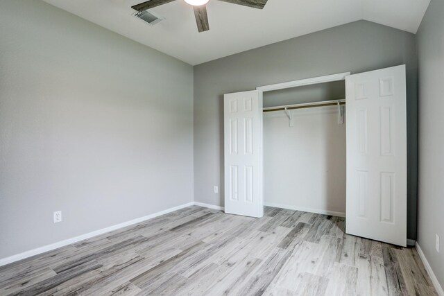 431 Cardinal Oaks, League City, TX 77565 - unfurnished bedroom with wood finished floors, a closet, ceiling fan, baseboards, and vaulted ceiling