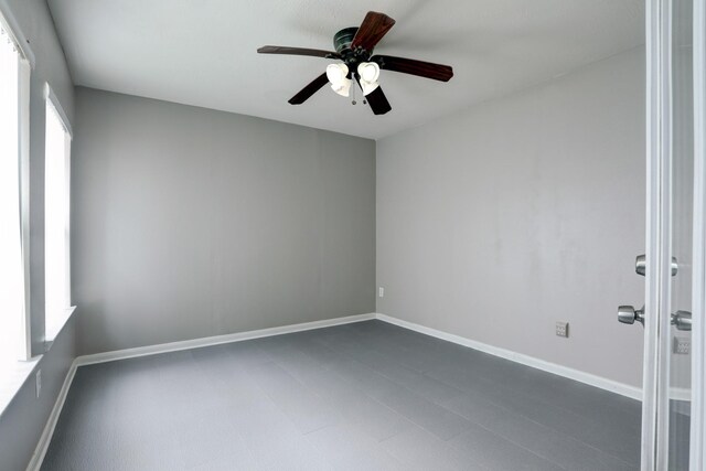431 Cardinal Oaks, League City, TX 77565 - empty room featuring a ceiling fan and baseboards