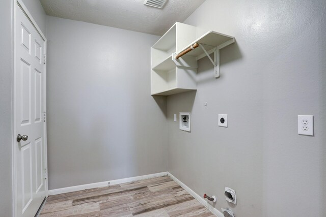 431 Cardinal Oaks, League City, TX 77565 - laundry room with gas dryer hookup, hookup for an electric dryer, hookup for a washing machine, light wood-type flooring, and baseboards