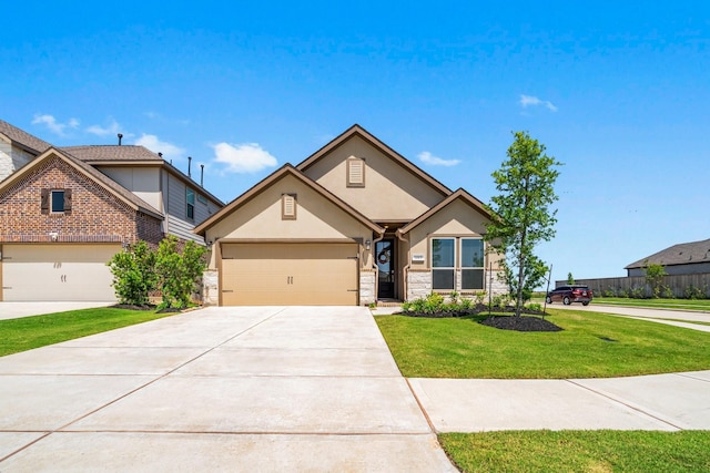3315 Bristle Ridge Ln, Brookshire, TX 77423 - view of front of home with stucco siding, stone siding, driveway, a front lawn, and an attached garage