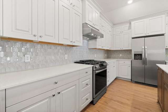 3315 Bristle Ridge Ln, Brookshire, TX 77423 - kitchen featuring appliances with stainless steel finishes, under cabinet range hood, light countertops, and decorative backsplash