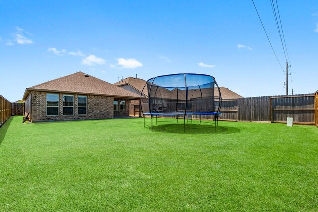 3315 Bristle Ridge Ln, Brookshire, TX 77423 - view of yard with a trampoline