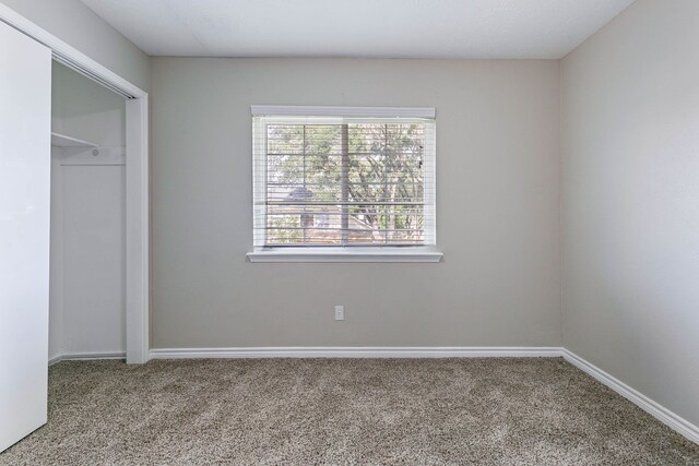 7402 Grackle Dr, Cypress, TX 77433 - unfurnished bedroom with carpet, baseboards, and a closet