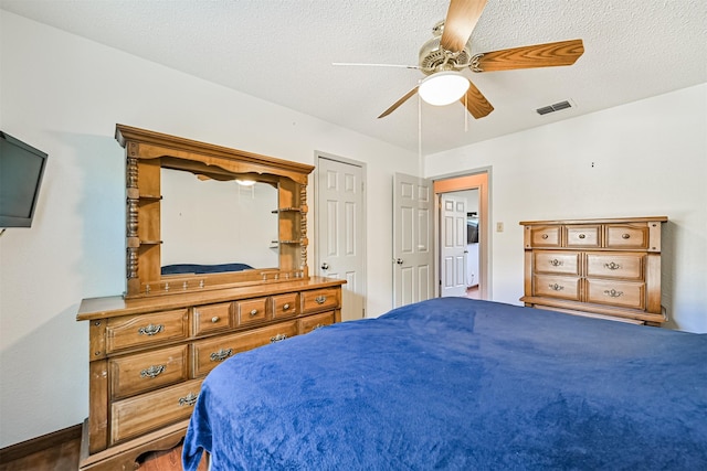16358 Havenpark Dr, Houston, TX 77059 - bedroom with ceiling fan and a textured ceiling