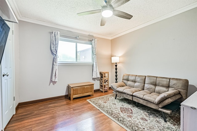 16358 Havenpark Dr, Houston, TX 77059 - living room featuring a textured ceiling, wood finished floors, ceiling fan, crown molding, and baseboards
