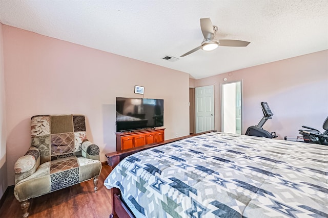 16358 Havenpark Dr, Houston, TX 77059 - bedroom featuring wood finished floors, a textured ceiling, and ceiling fan