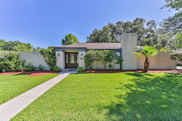 16358 Havenpark Dr, Houston, TX 77059 - single story home featuring a front lawn, a chimney, and brick siding