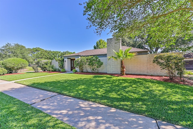 16358 Havenpark Dr, Houston, TX 77059 - view of front of home with brick siding and a chimney