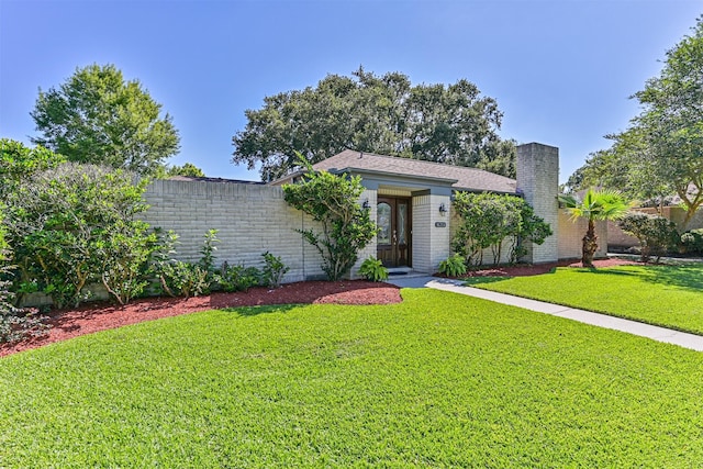 16358 Havenpark Dr, Houston, TX 77059 - view of front of house with brick siding and a chimney