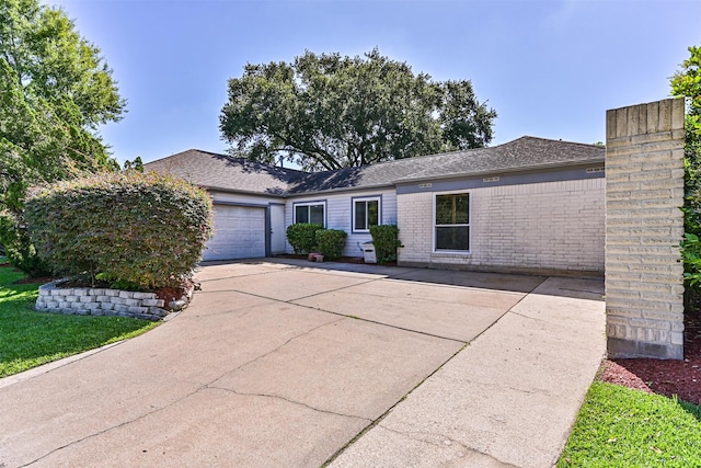 16358 Havenpark Dr, Houston, TX 77059 - single story home featuring an attached garage, driveway, brick siding, and a chimney