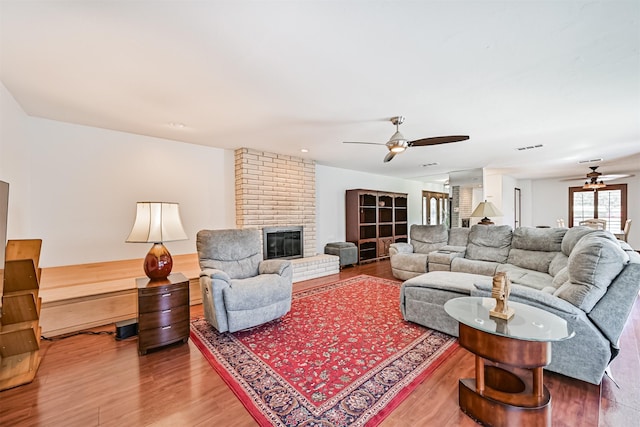 16358 Havenpark Dr, Houston, TX 77059 - living area with a ceiling fan, wood finished floors, and a brick fireplace