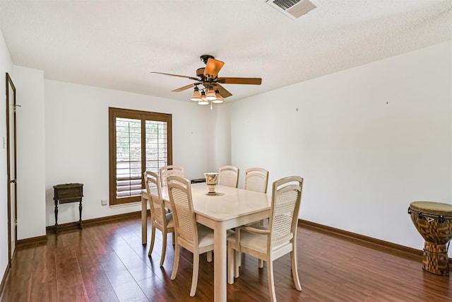 16358 Havenpark Dr, Houston, TX 77059 - dining room with ceiling fan, dark wood finished floors, baseboards, and a textured ceiling