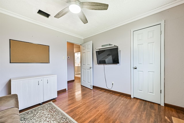 16358 Havenpark Dr, Houston, TX 77059 - unfurnished living room with crown molding, wood finished floors, a ceiling fan, baseboards, and a textured ceiling