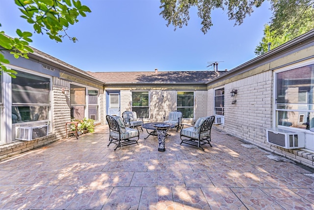 16358 Havenpark Dr, Houston, TX 77059 - view of patio / terrace with cooling unit and an outdoor living space with a fire pit