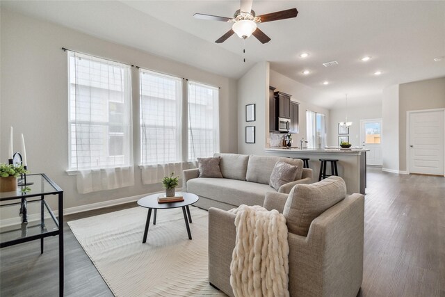 18414 Christine Elizabeth Ln, New Caney, TX 77357 - living room featuring baseboards, dark wood finished floors, healthy amount of natural light, and recessed lighting