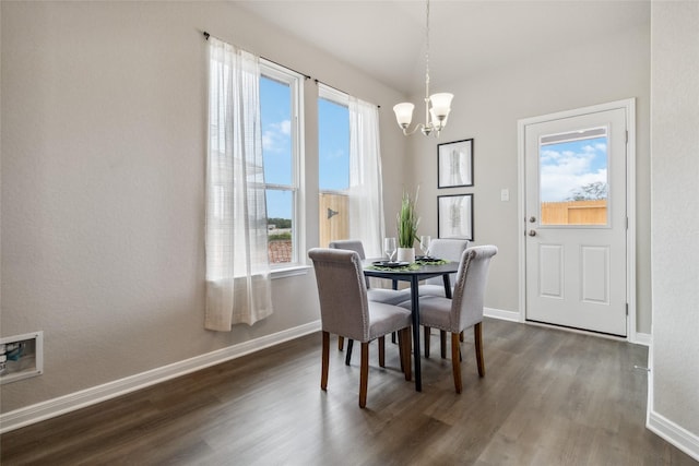 18414 Christine Elizabeth Ln, New Caney, TX 77357 - dining area with a chandelier, healthy amount of natural light, dark wood finished floors, and baseboards