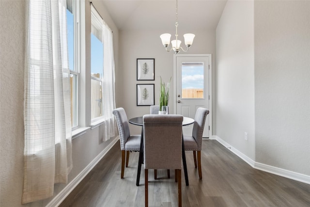 18414 Christine Elizabeth Ln, New Caney, TX 77357 - dining room with healthy amount of natural light, a chandelier, dark wood-style flooring, and vaulted ceiling