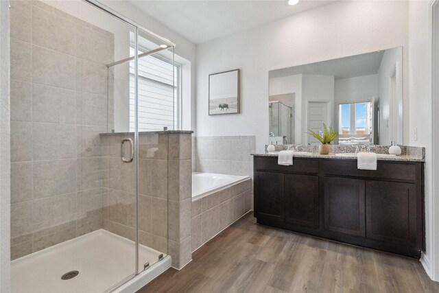 18414 Christine Elizabeth Ln, New Caney, TX 77357 - bathroom with a shower stall, a bath, plenty of natural light, and double vanity