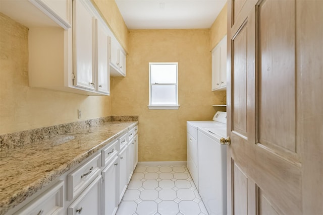 8410 Atascocita Lake Way, Humble, TX 77346 - washroom with cabinet space, separate washer and dryer, and baseboards