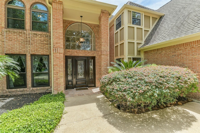 8410 Atascocita Lake Way, Humble, TX 77346 - property entrance featuring brick siding and roof with shingles