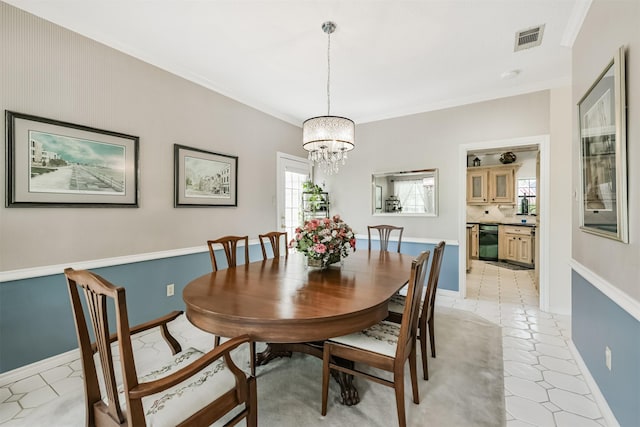 8410 Atascocita Lake Way, Humble, TX 77346 - dining area featuring a chandelier, crown molding, and baseboards