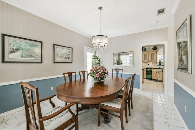8410 Atascocita Lake Way, Humble, TX 77346 - dining room with a chandelier, ornamental molding, and baseboards