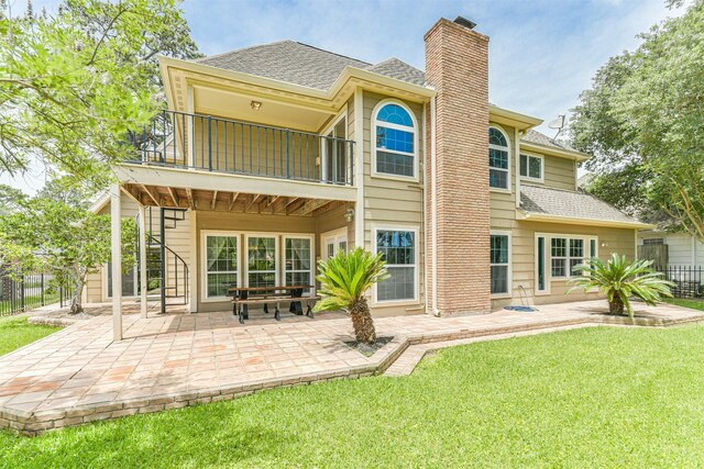 8410 Atascocita Lake Way, Humble, TX 77346 - rear view of property featuring a balcony, a chimney, a shingled roof, a patio area, and stairway