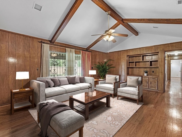 11821 15th St, Santa Fe, TX 77510 - living room with wood walls, wood finished floors, a ceiling fan, and built in features