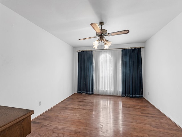 11821 15th St, Santa Fe, TX 77510 - empty room featuring wood finished floors and ceiling fan