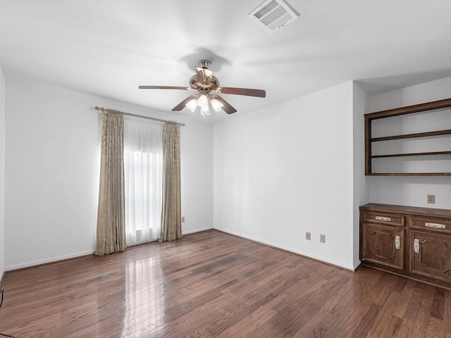 11821 15th St, Santa Fe, TX 77510 - empty room featuring ceiling fan, wood finished floors, and baseboards