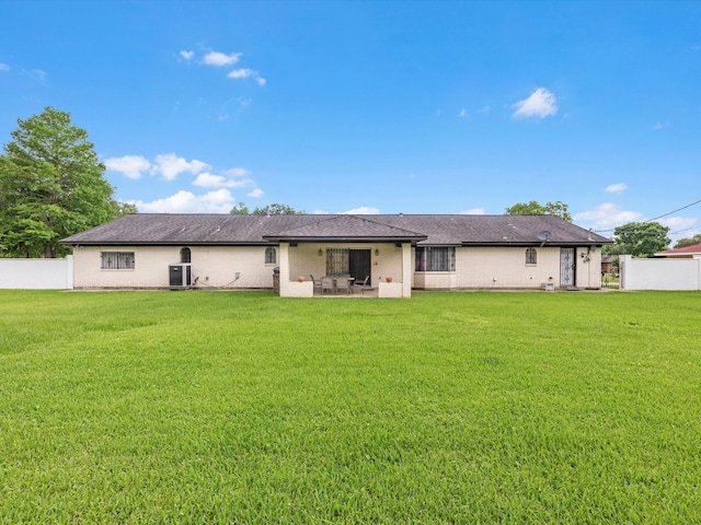 11821 15th St, Santa Fe, TX 77510 - rear view of property featuring a patio, brick siding, and central AC