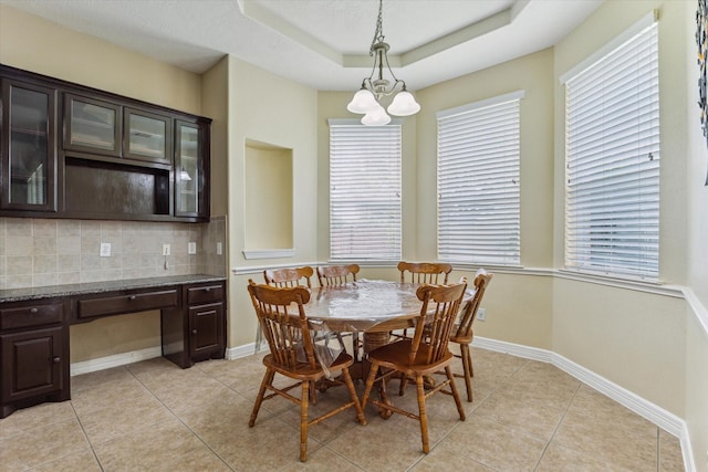 10707 Mandavilla Dr, Houston, TX 77095 - dining space featuring plenty of natural light, light tile patterned floors, and baseboards