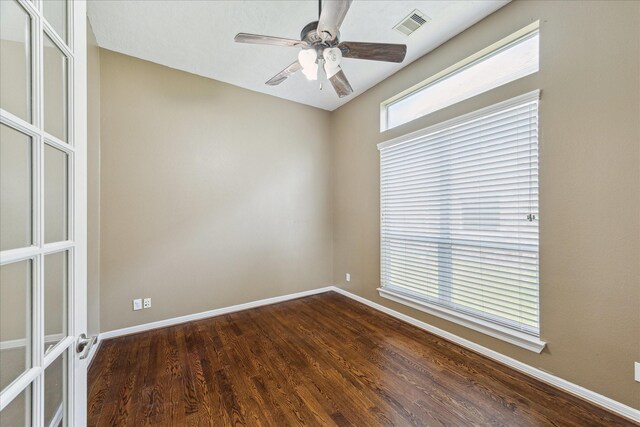 10707 Mandavilla Dr, Houston, TX 77095 - empty room featuring dark wood-style floors, ceiling fan, and baseboards