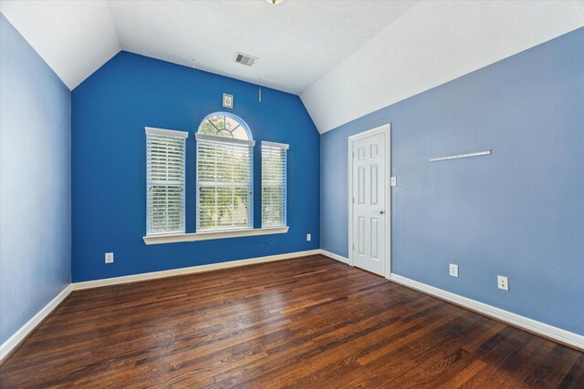 10707 Mandavilla Dr, Houston, TX 77095 - spare room with vaulted ceiling, wood finished floors, and baseboards