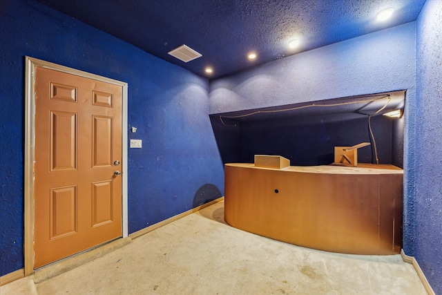 10707 Mandavilla Dr, Houston, TX 77095 - miscellaneous room featuring carpet, baseboards, and a textured wall