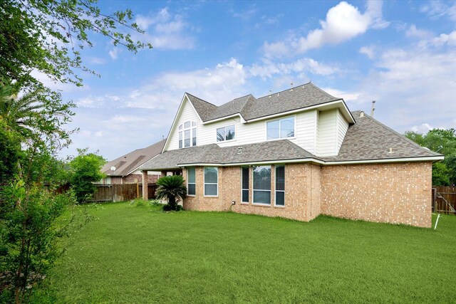 10707 Mandavilla Dr, Houston, TX 77095 - rear view of property with roof with shingles and brick siding