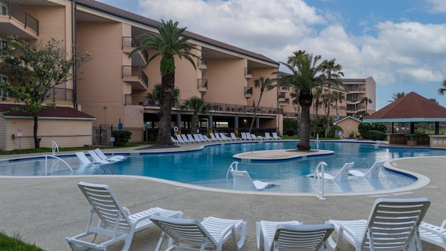 9520 Seawall Blvd Unit 152, Galveston, TX 77554 - community pool with a patio area and a gazebo