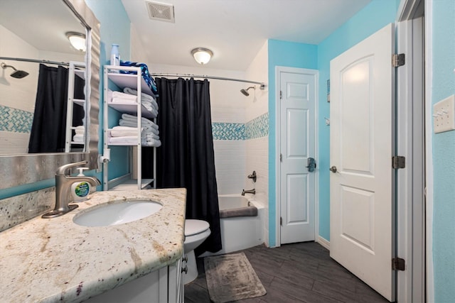 9520 Seawall Blvd Unit 152, Galveston, TX 77554 - bathroom featuring vanity, shower / bathtub combination with curtain, wood finished floors, and toilet