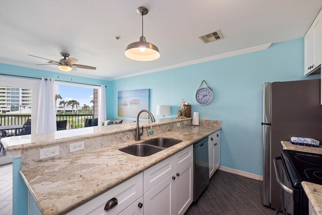 9520 Seawall Blvd Unit 152, Galveston, TX 77554 - kitchen with a sink, dishwashing machine, a peninsula, white cabinetry, and crown molding