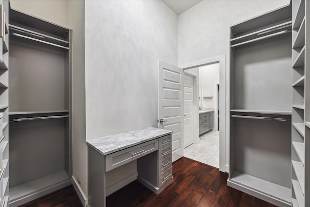 1032 W 18th St, Houston, TX 77008 - walk in closet with dark wood-style flooring