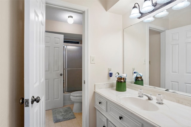 22015 Fielder Dr, Katy, TX 77450 - bathroom with toilet, vanity, tile patterned flooring, and shower / bath combination with glass door